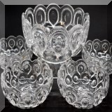 G11. Pressed glass footed serving bowl with 6 matching smaller bowls. - $18 